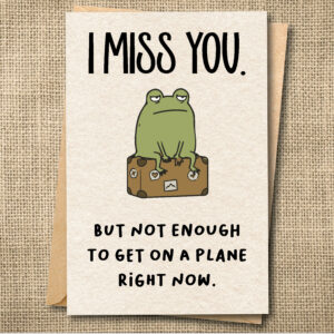 Funny miss you greeting card with Ferg sitting on a suitcase and the message I Miss You But Not Enough to Get on a Plane Right Now