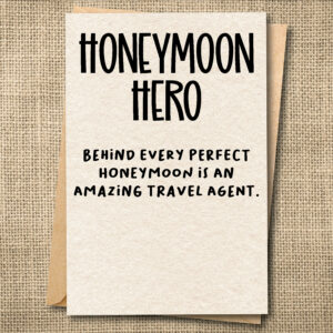Funny honeymoon travel agent greeting card saying Honeymoon Hero — Behind Every Perfect Honeymoon Is an Amazing Travel Agent.