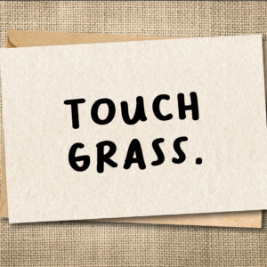 Funny Touch Grass greeting card with bold black typography